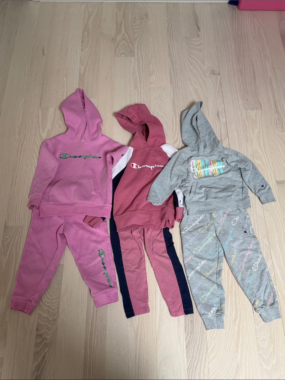 3 Champions sweatsuits